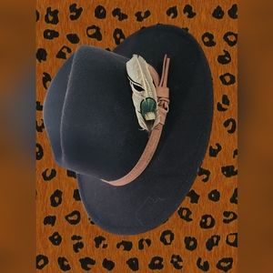 Black fedora with added feather